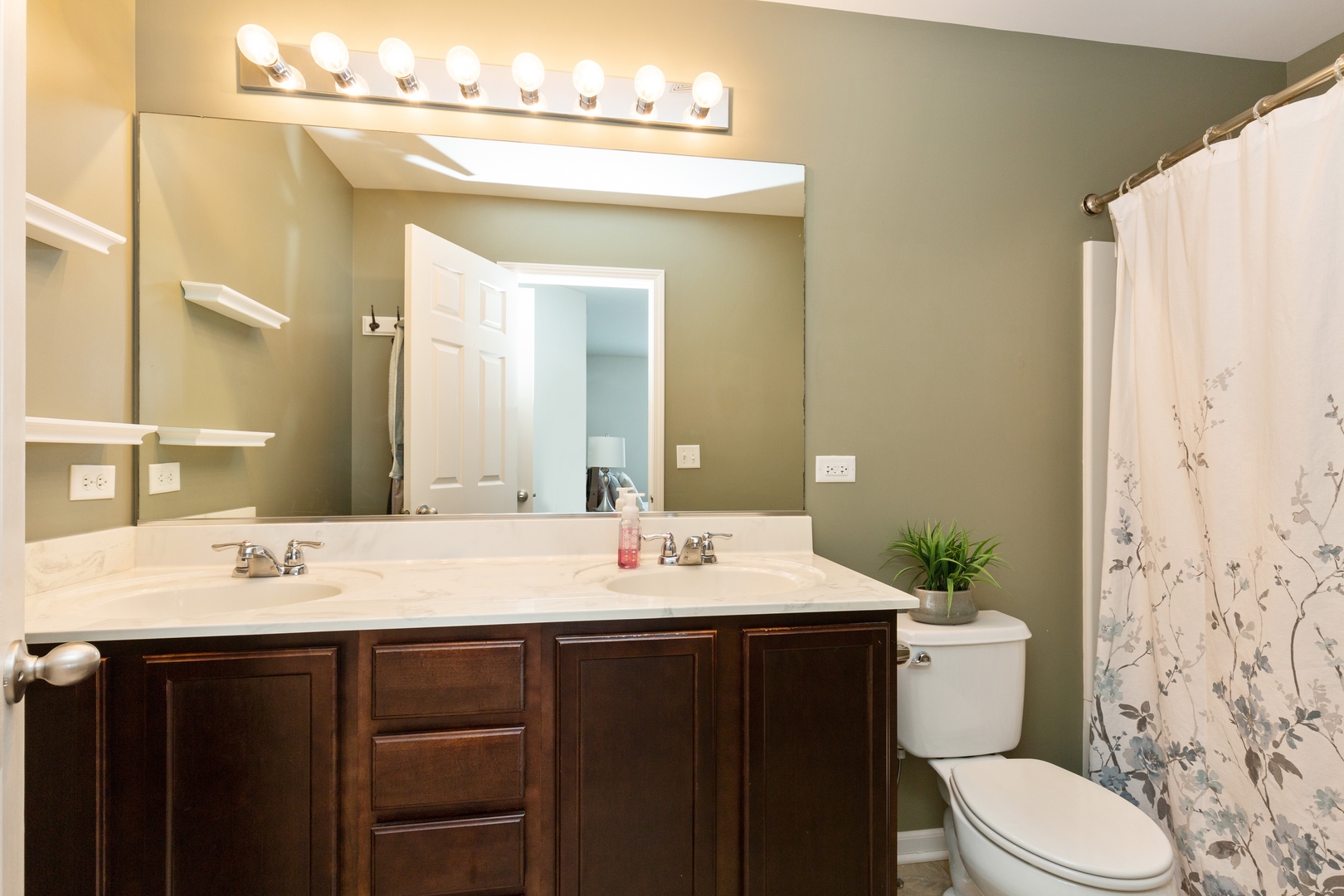 26 Boathouse Road Pingree Grove, IL 60140 - Photo 8 of 12 a bathroom with a sink vanity mirror and toilet