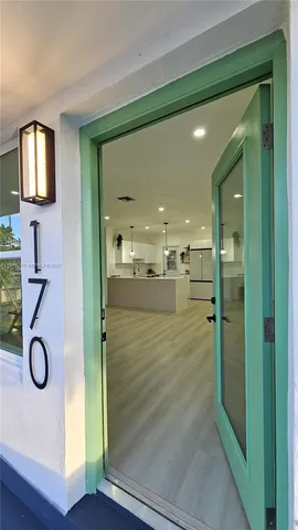 a bathroom with a glass shower door