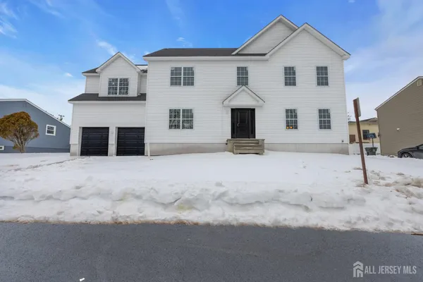 a view of a white house with a yard