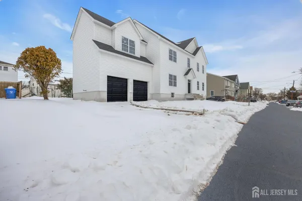 a view of a house with a snow in the yard
