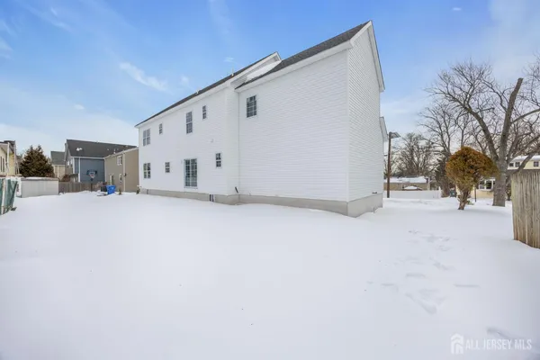 a view of a house with a snow in yard