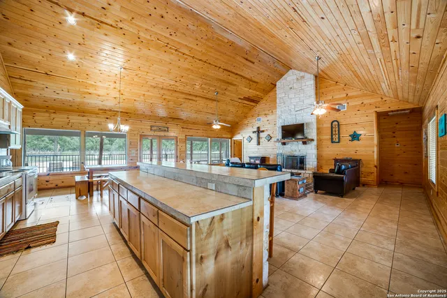 a view of a patio with swimming pool table and chairs