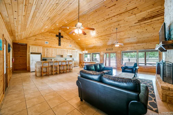 a living room with lots of furniture and natural light