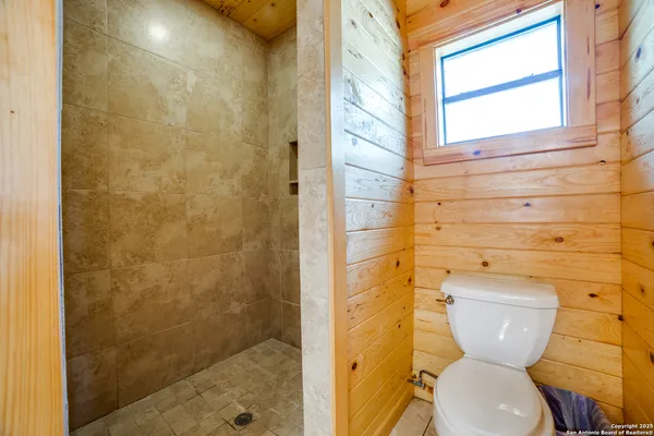 a bedroom with a bed and a walk in closet