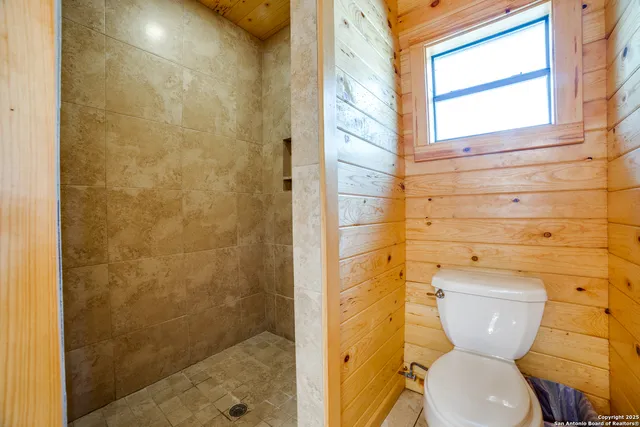 a bedroom with a bed and a walk in closet