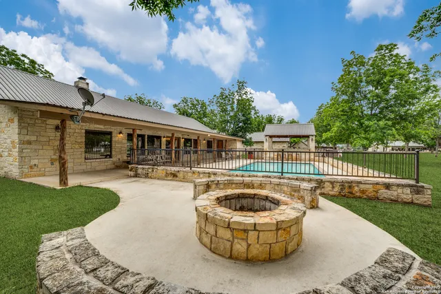 an outdoor space with furniture and garden