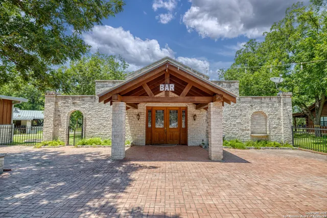 a view of a swimming pool with outdoor seating