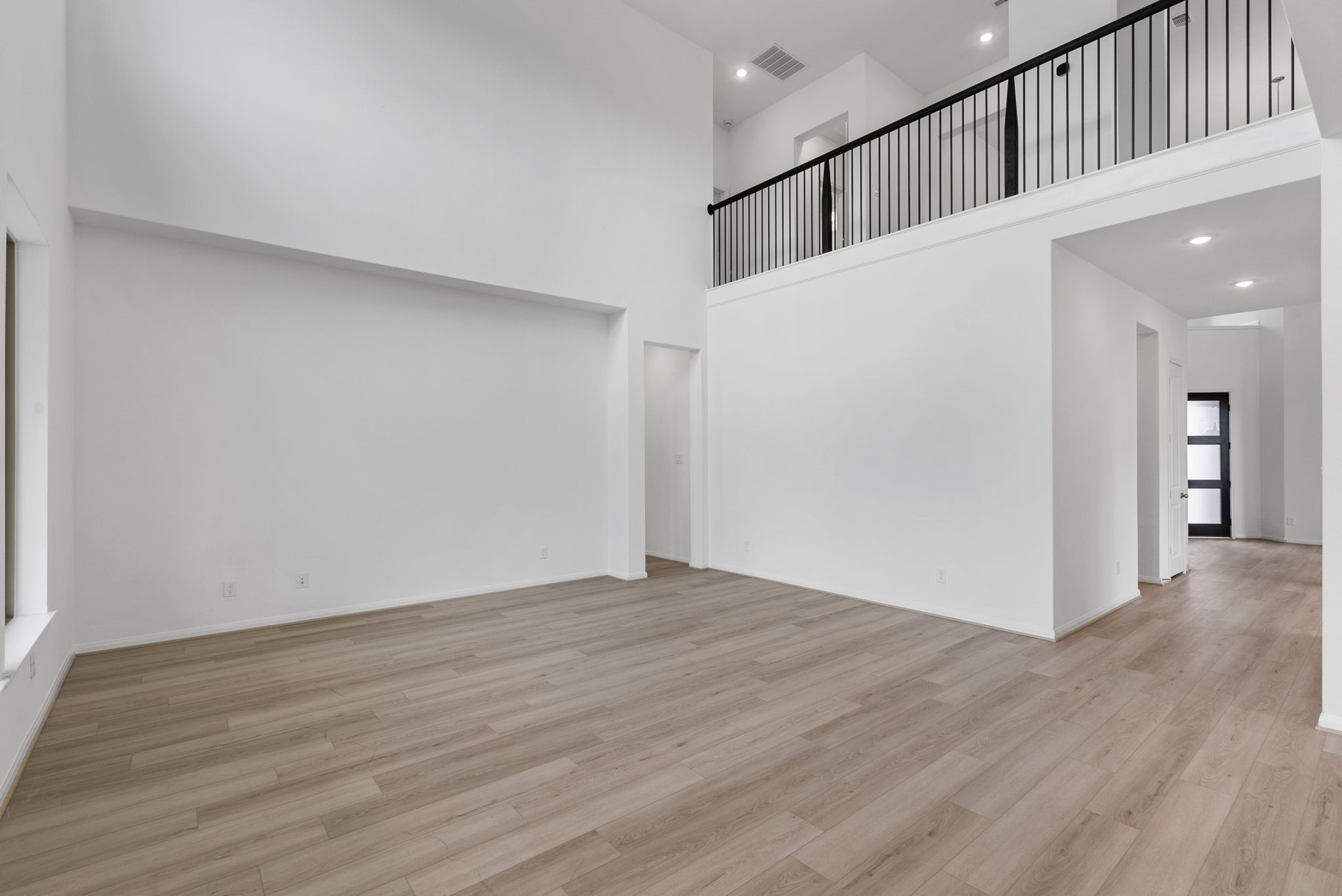 18810 Forested Street Manvel, TX 77578 - Photo 12 of 35 a view of a hallway with wooden floor