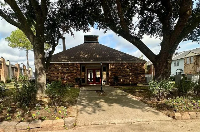 a view of a balcony with wooden floor and a floor to ceiling window