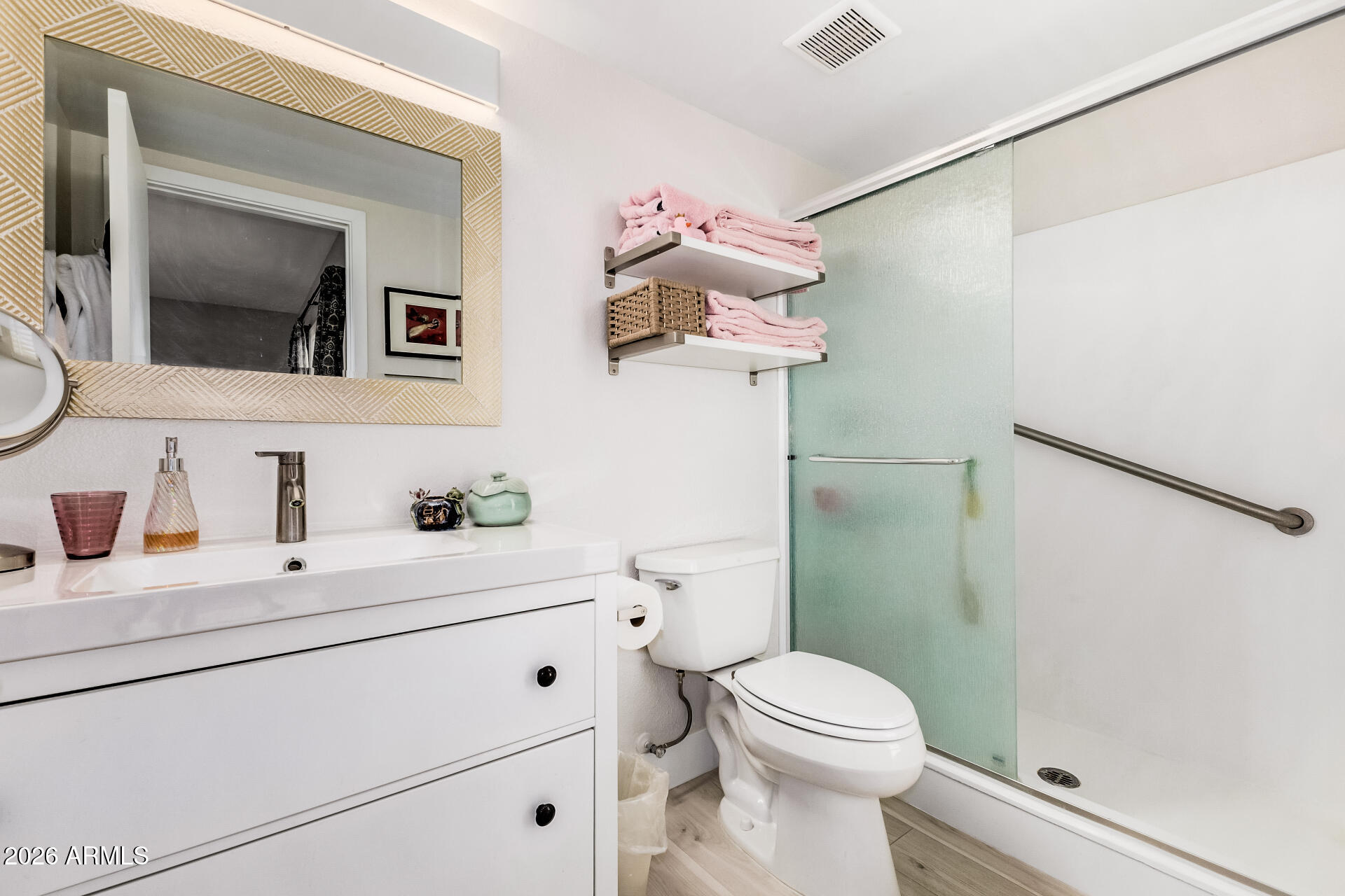 26055 North Bravo Lane Rio Verde, AZ 85263 - Photo 13 of 26 a bathroom with a toilet sink and mirror