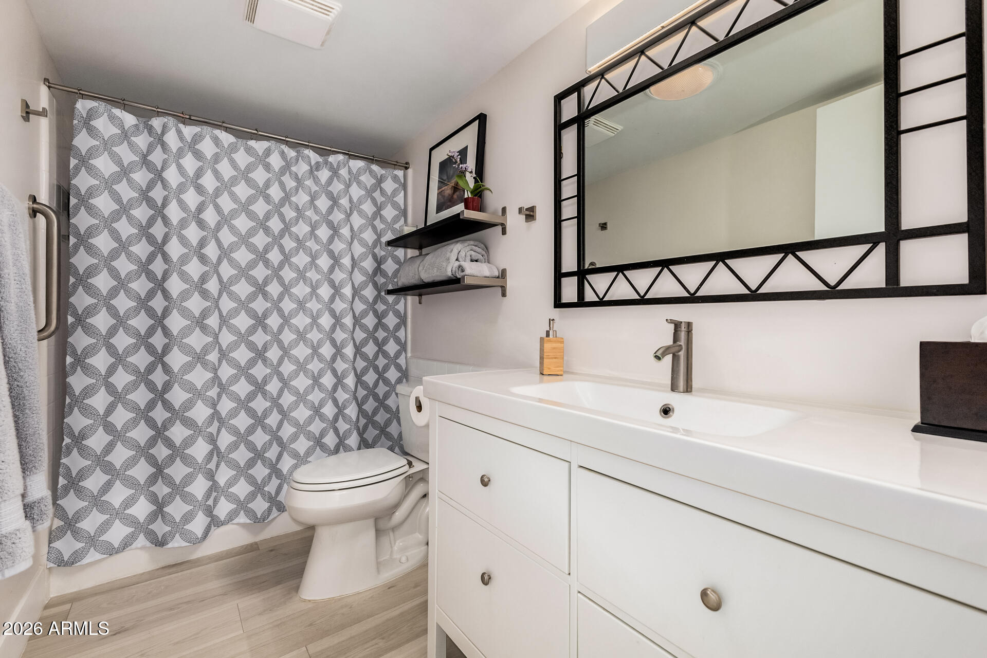 26055 North Bravo Lane Rio Verde, AZ 85263 - Photo 16 of 26 a bathroom with a toilet and a sink