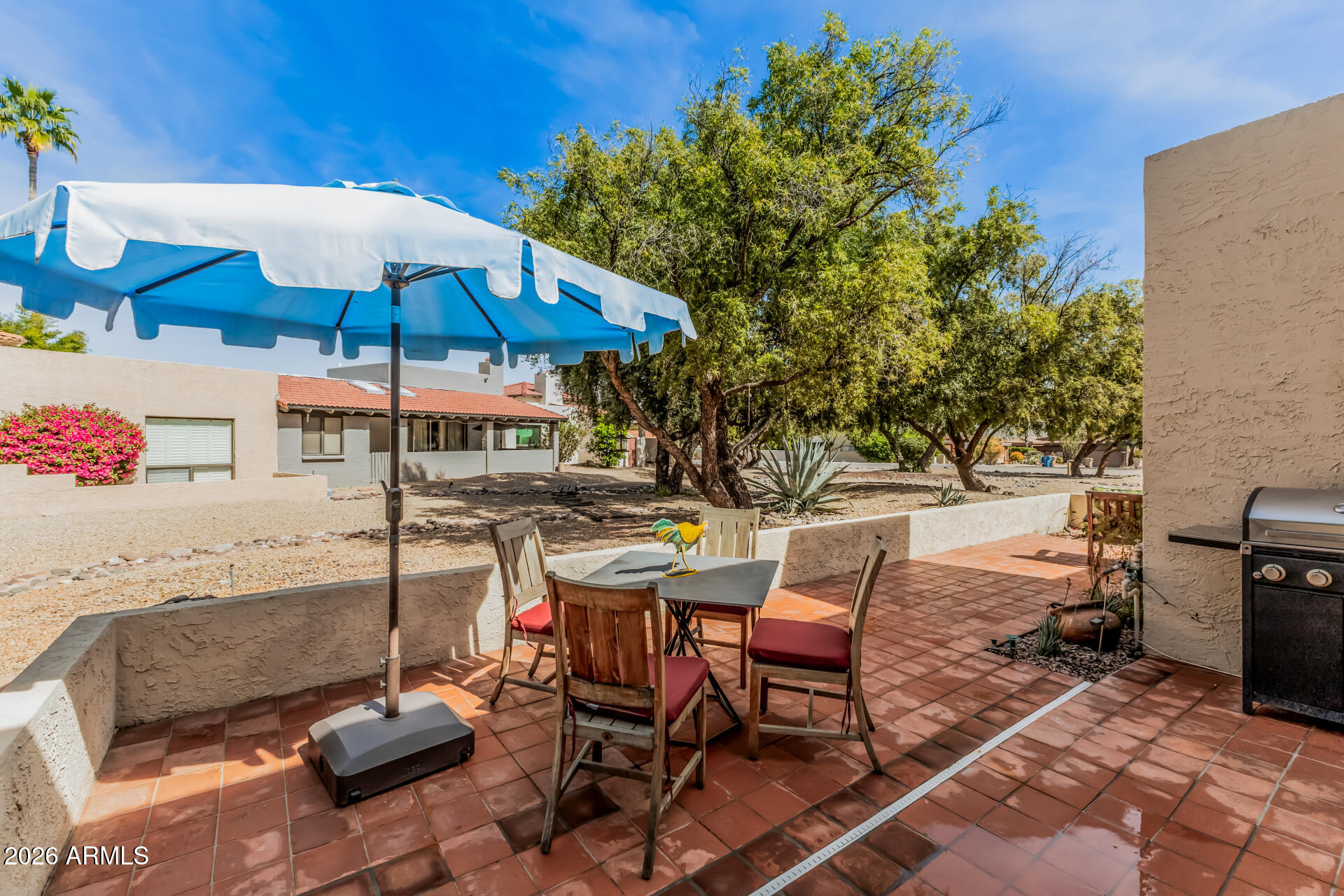 26055 North Bravo Lane Rio Verde, AZ 85263 - Photo 19 of 26 a view of backyard with outdoor seating and plants