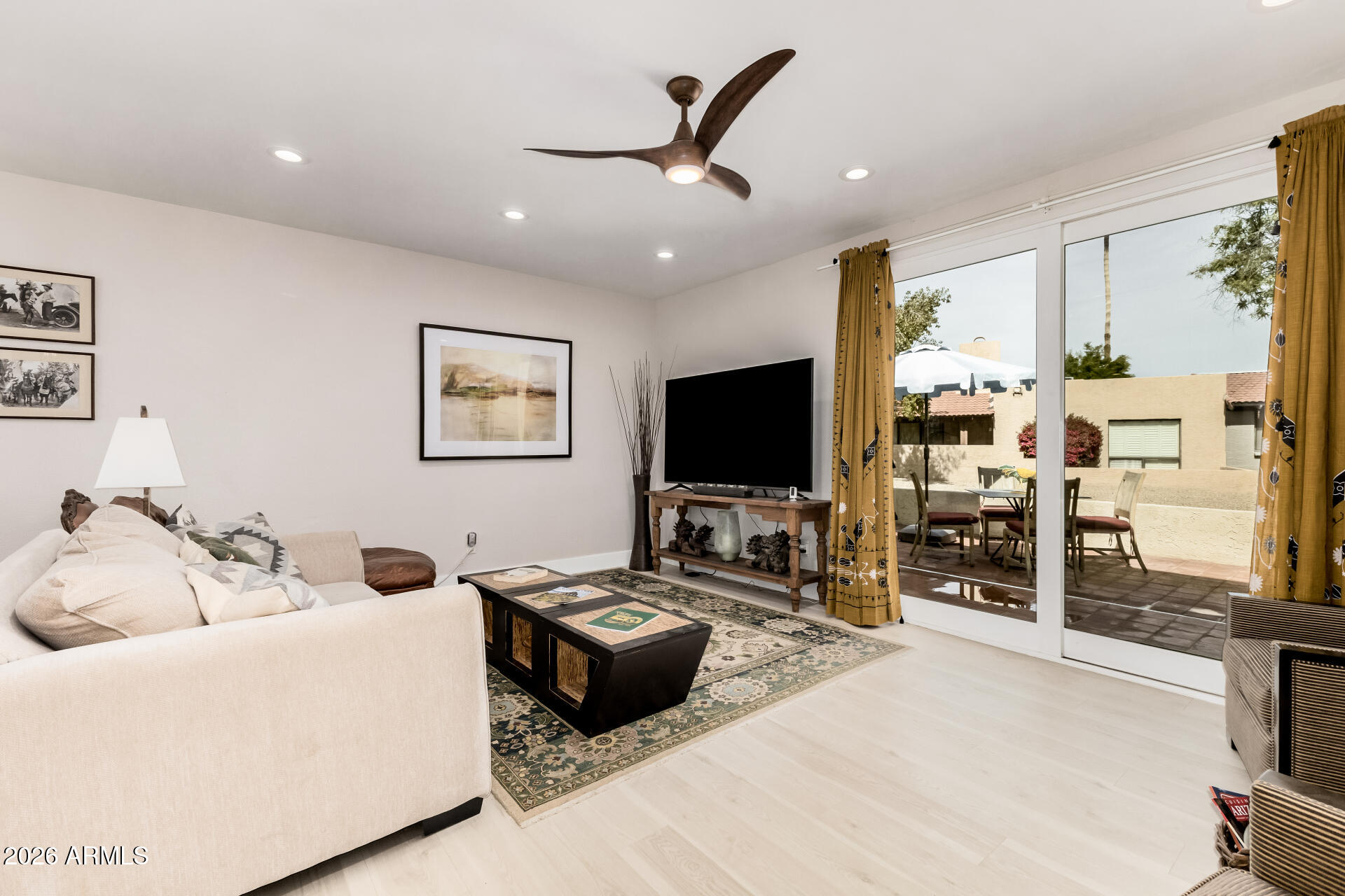 26055 North Bravo Lane Rio Verde, AZ 85263 - Photo 5 of 26 a living room with furniture and a flat screen tv
