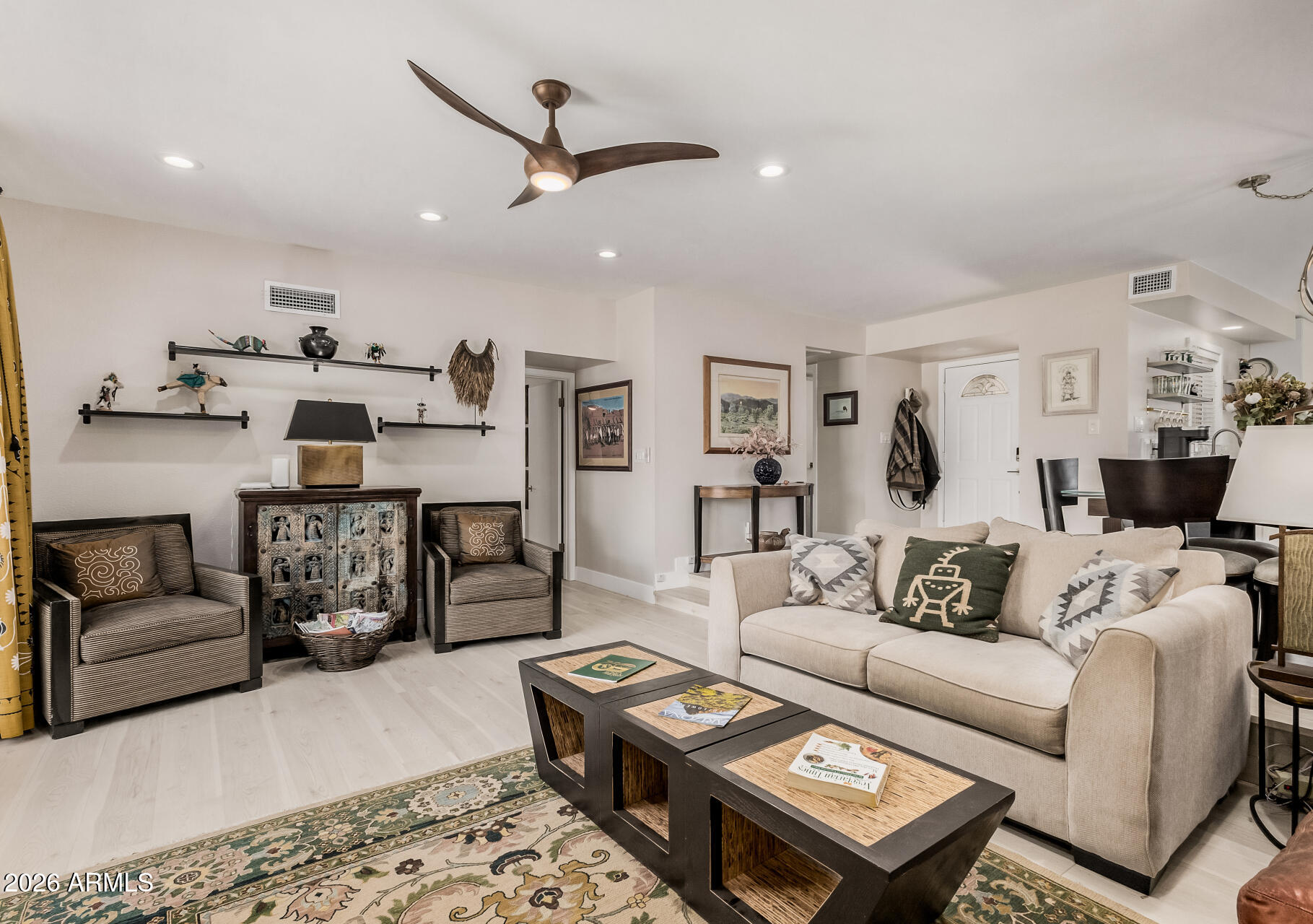 26055 North Bravo Lane Rio Verde, AZ 85263 - Photo 6 of 26 a living room with furniture and a wooden floor