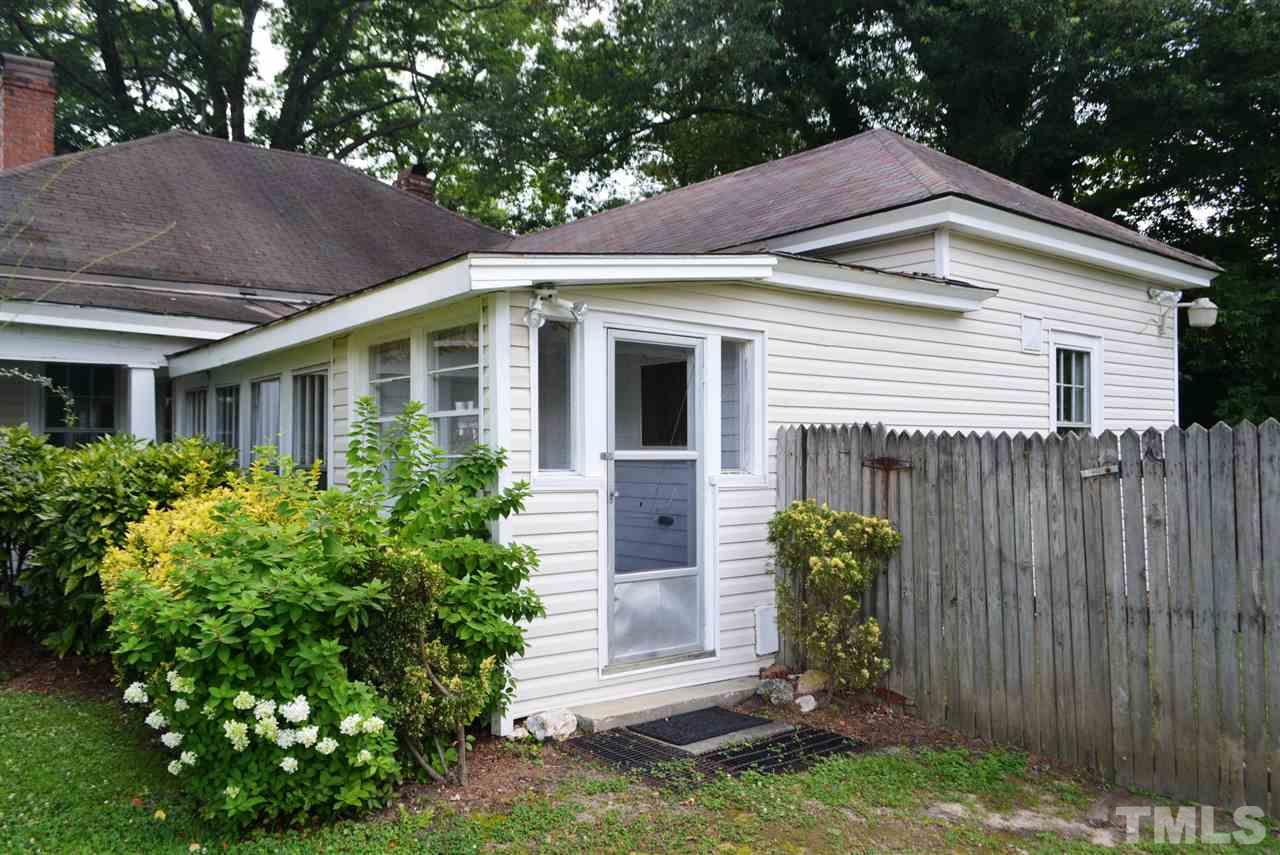 317 South Walnut Street Spring Hope, NC 27882 - Photo 3 of 14 a front view of a house with garden