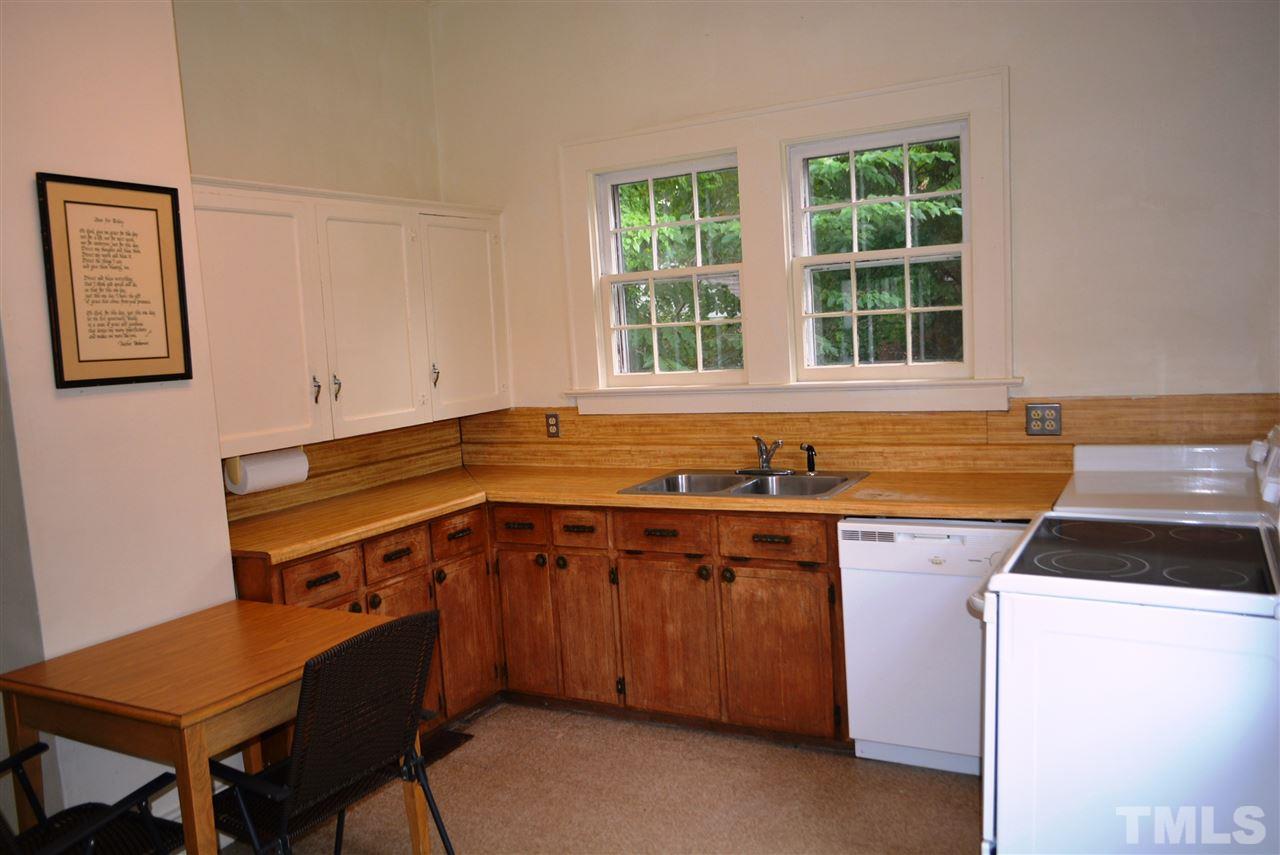 317 South Walnut Street Spring Hope, NC 27882 - Photo 4 of 14 a kitchen with a stove a sink and a cabinets