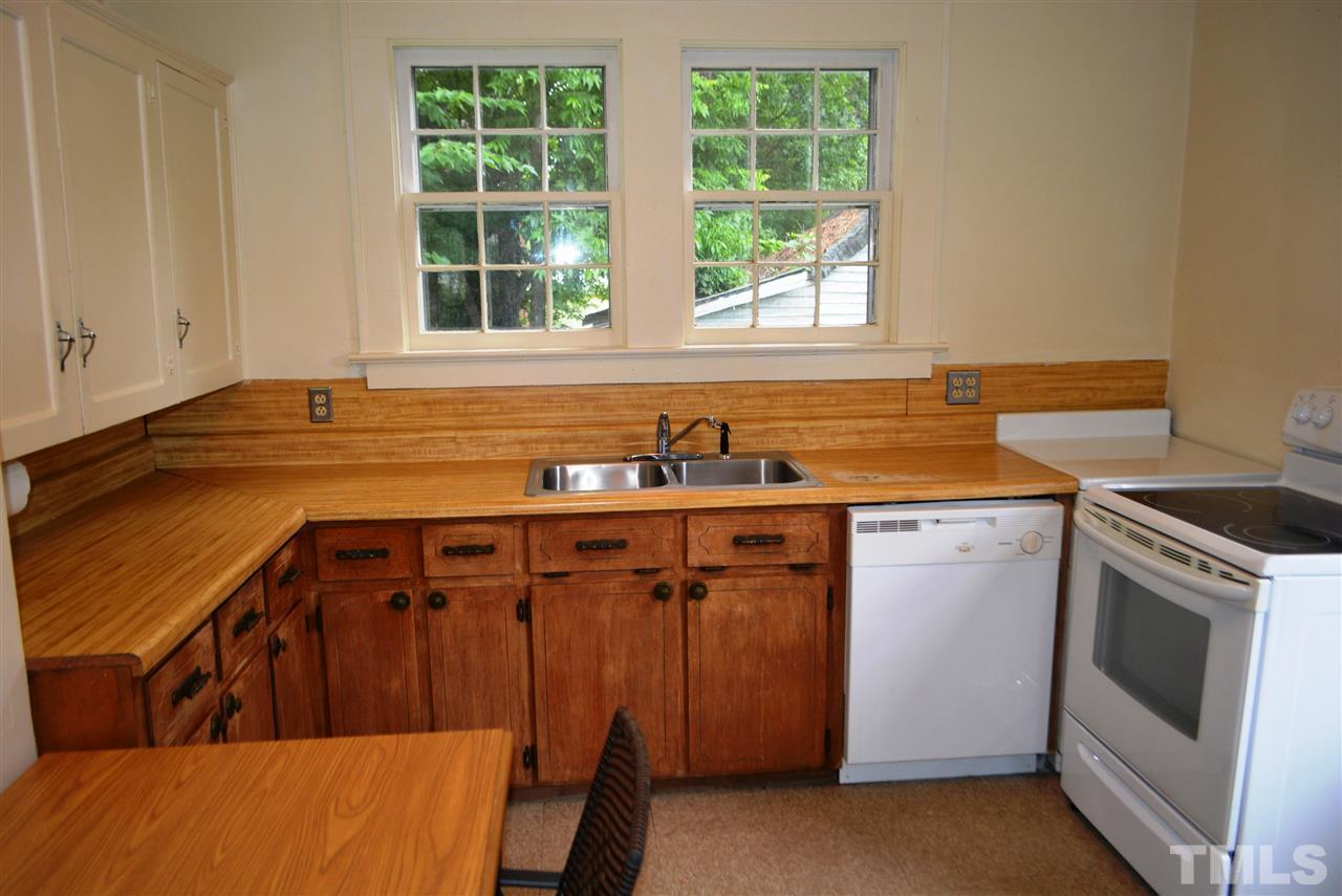 317 South Walnut Street Spring Hope, NC 27882 - Photo 5 of 14 a view of a kitchen with fridge and windows