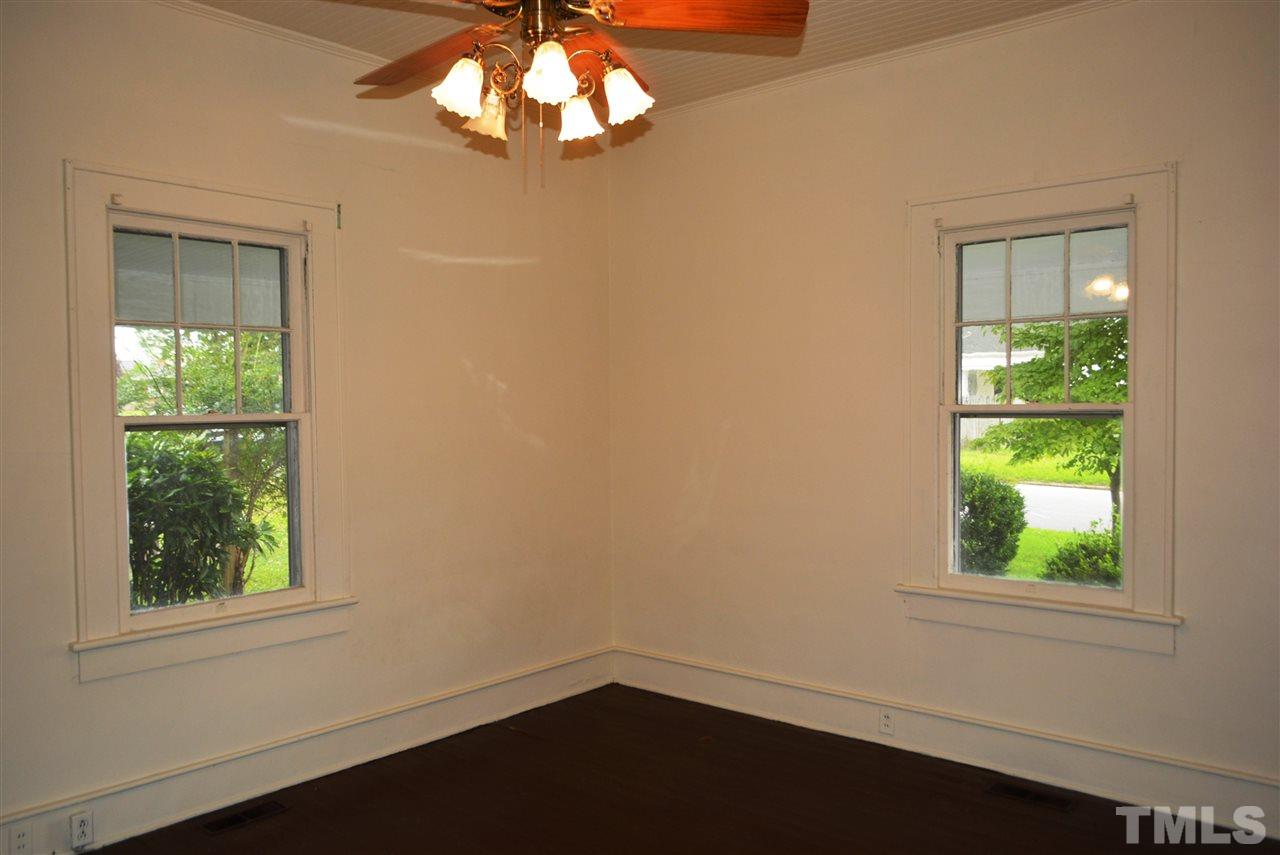 317 South Walnut Street Spring Hope, NC 27882 - Photo 7 of 14 an empty room with a window