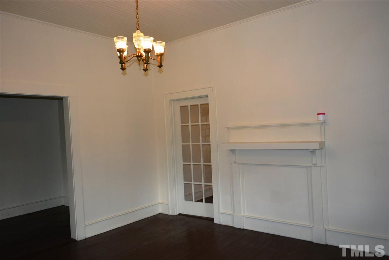 317 South Walnut Street Spring Hope, NC 27882 - Photo 8 of 14 a room with chandelier and wooden floor