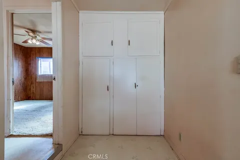 a view of room with a ceiling fan and window