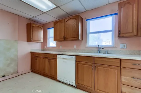 a kitchen with sink and cabinets