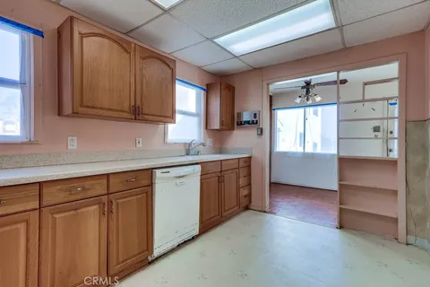 a kitchen with cabinets and a window