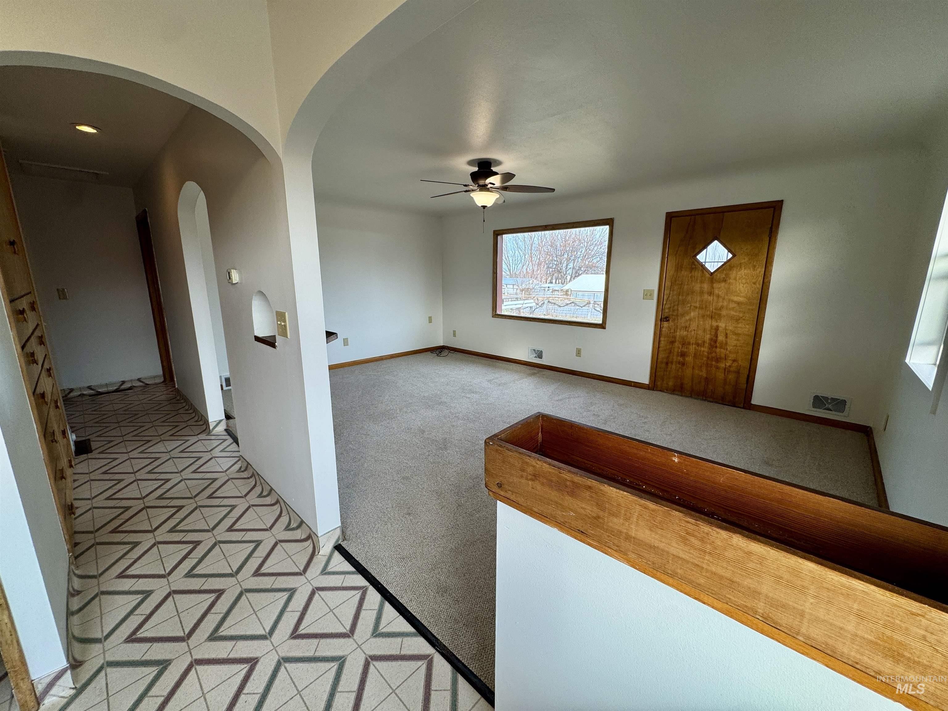 3989 North 2250 East Filer, ID 83328 - Photo 15 of 26 Hall featuring light colored carpet and arched walkways
