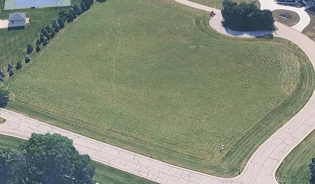 a view of a balcony with chair and table
