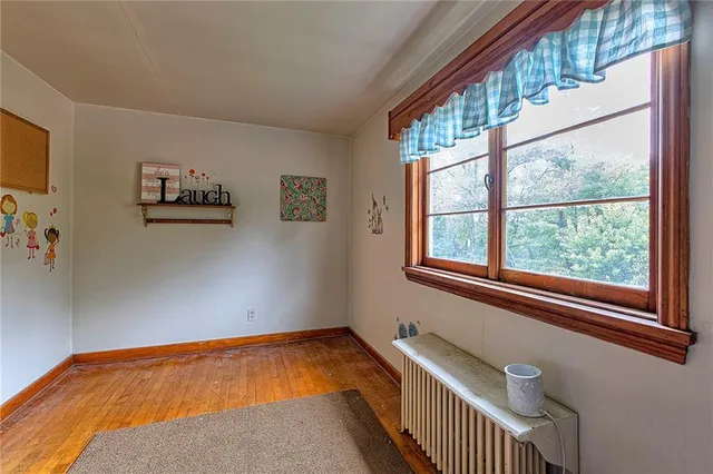 a bedroom with bed and a window