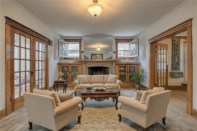 a living room with furniture and a fireplace