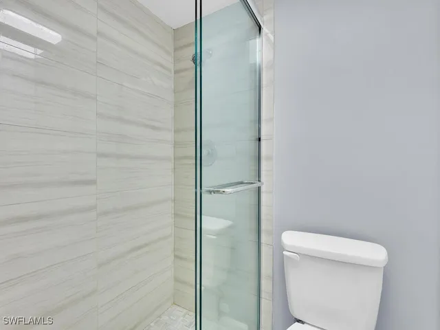 a bed room with a bed and a dresser