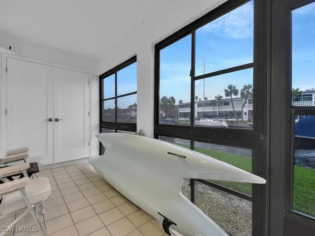 an aerial view of residential building and car parked