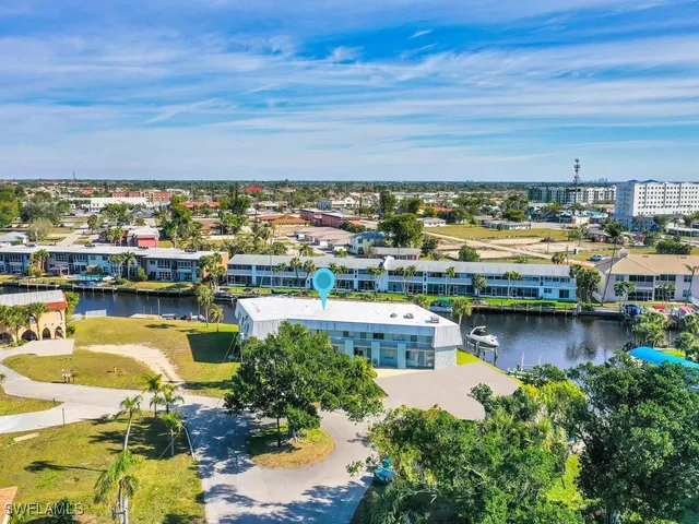 an aerial view of city and lake