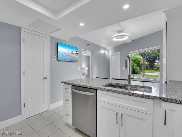 a kitchen with stainless steel appliances a refrigerator stove and microwave