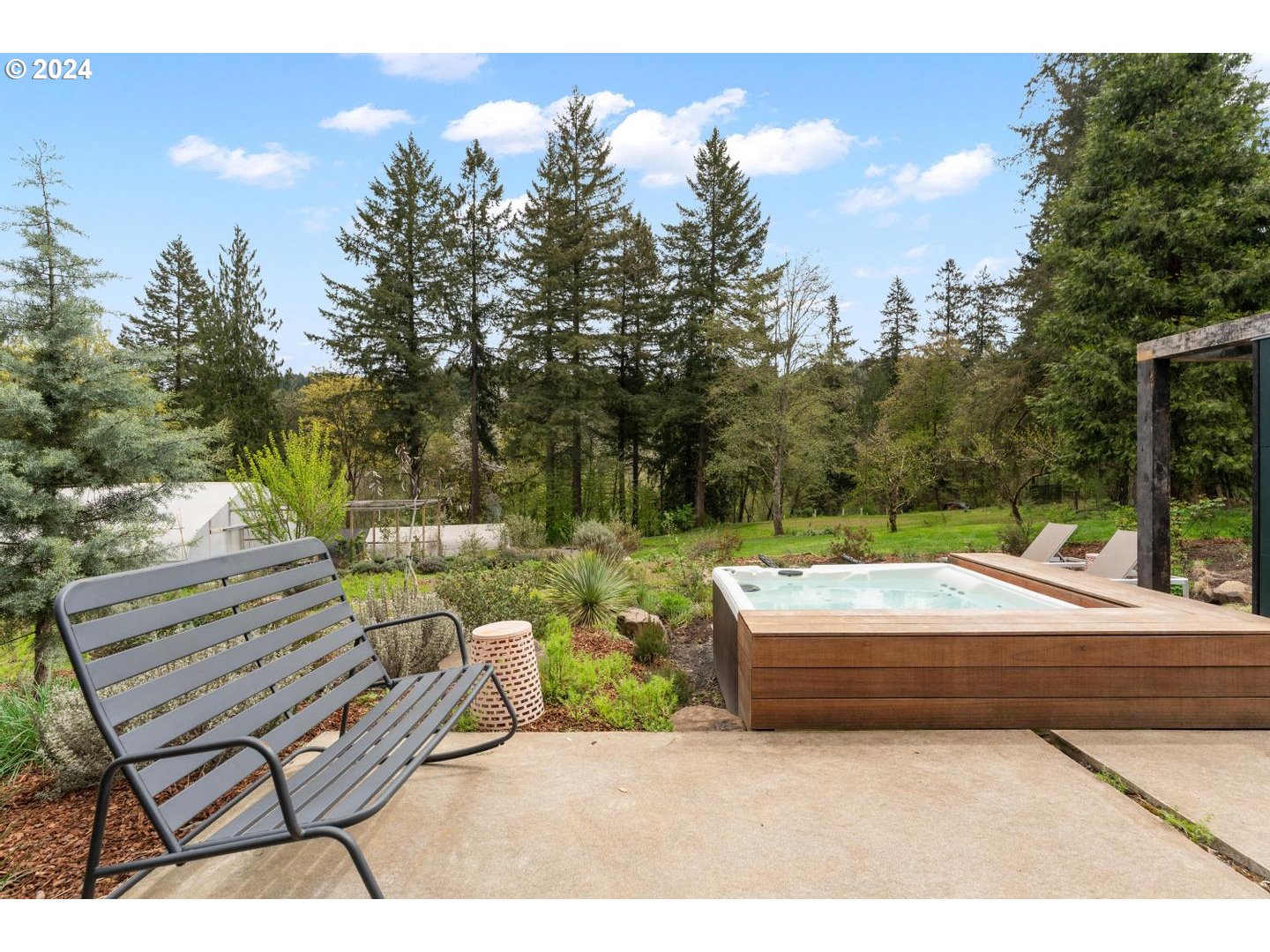 14425 Northwest Cornelius Pass Road Portland, OR 97231 - Photo 16 of 48 a backyard of a house with table and chairs