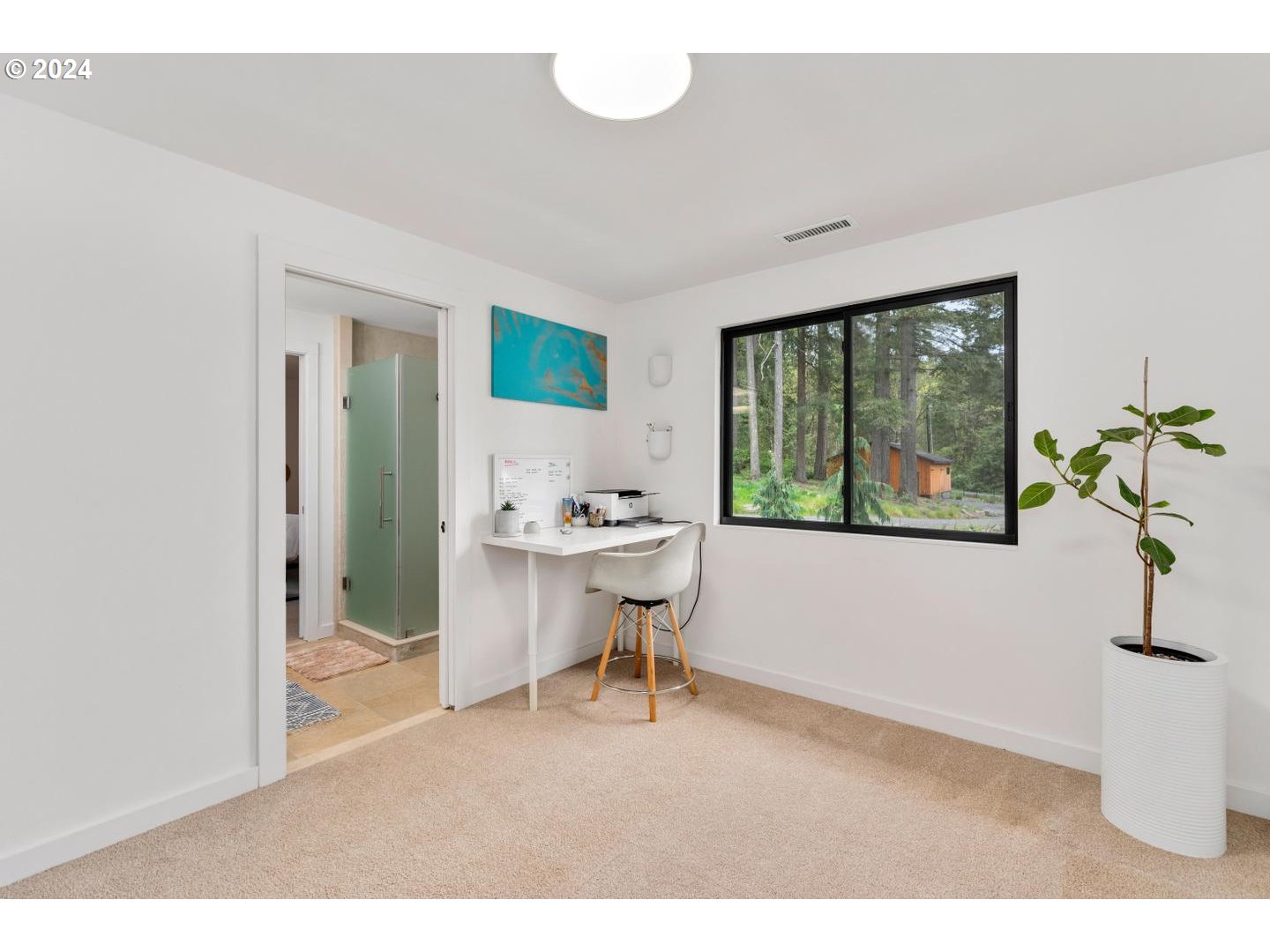 14425 Northwest Cornelius Pass Road Portland, OR 97231 - Photo 22 of 48 a living room with furniture and a potted plant