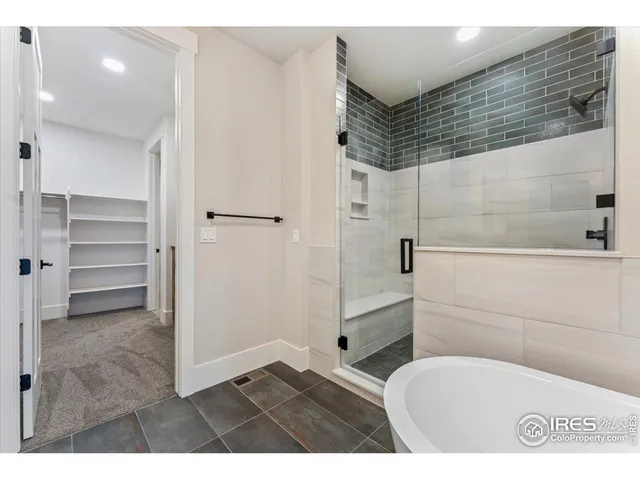 a open kitchen with cabinets and wooden floor