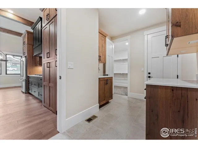 a bathroom with a granite countertop sink mirror toilet and bathtub