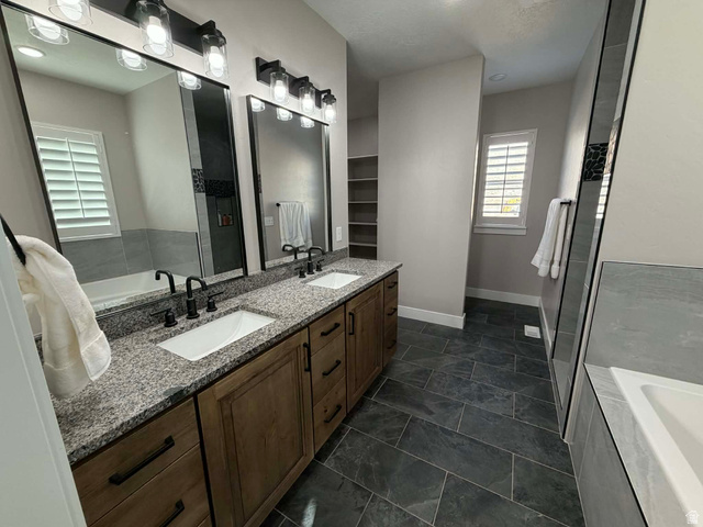 2350 North 1075 West Helper, UT 84526 - Photo 15 of 49 Bathroom with a bath and double vanity