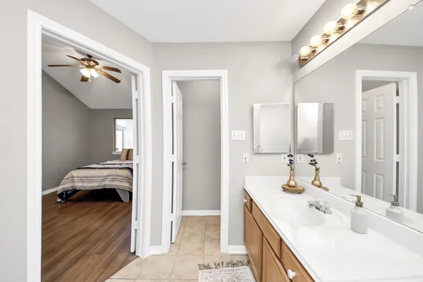 a bathroom with a sink double vanity and a mirror