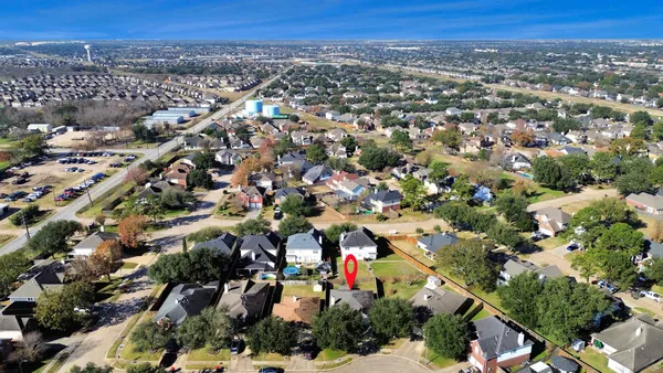 an aerial view of a city with lots of residential buildings