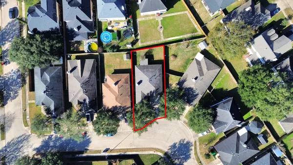 an aerial view of houses with yard