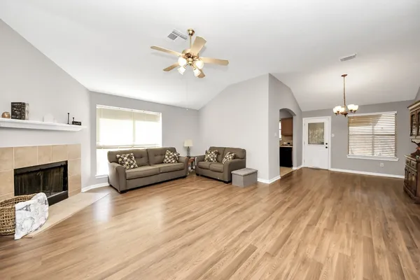 a living room with furniture and a fireplace