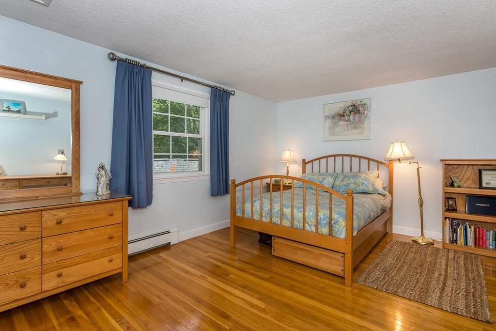 24 Mohawk Road Canton, MA 02021 - Photo 20 of 34 a bedroom with furniture and a book shelf