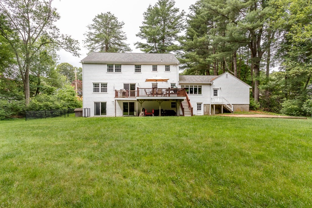 24 Mohawk Road Canton, MA 02021 - Photo 30 of 34 a view of a house with a big yard and large trees