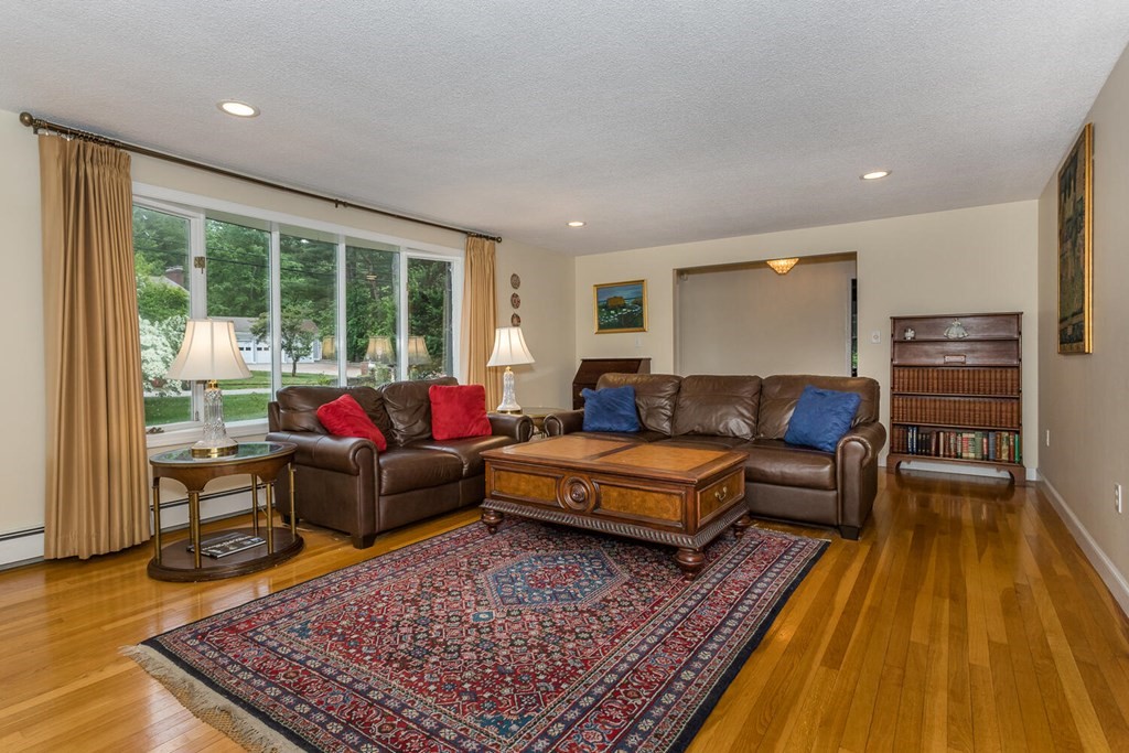 24 Mohawk Road Canton, MA 02021 - Photo 3 of 34 a living room with furniture and a rug