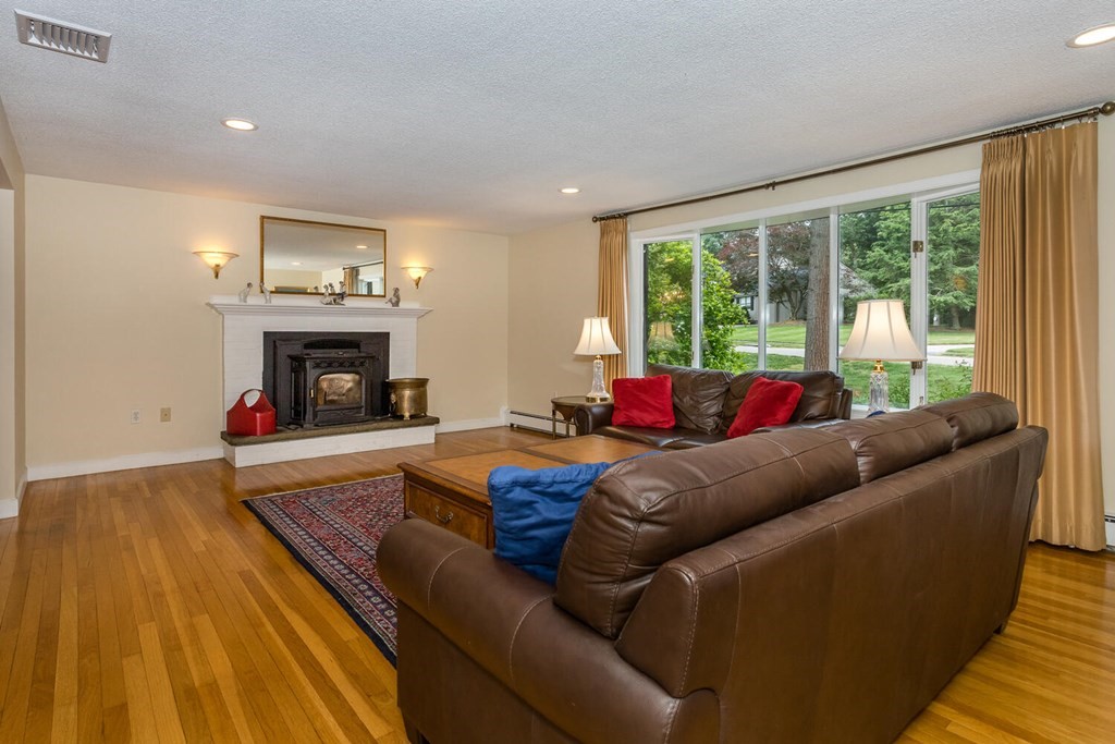 24 Mohawk Road Canton, MA 02021 - Photo 4 of 34 a living room with furniture and a fireplace