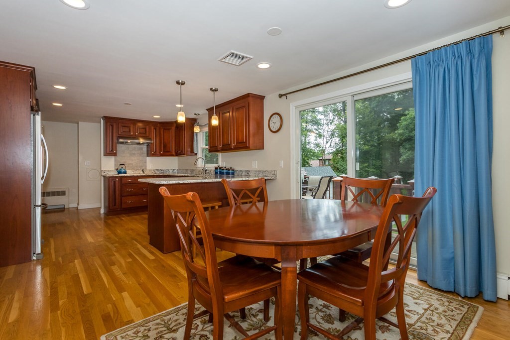 24 Mohawk Road Canton, MA 02021 - Photo 7 of 34 a dining room with furniture and a floor to ceiling window