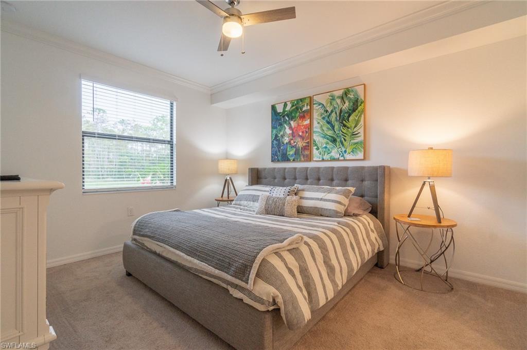 9596 Trevi Court, Unit 5414 Naples, FL 34113 - Photo 11 of 34 a bedroom with a bed and a window