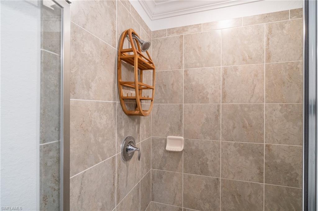 9596 Trevi Court, Unit 5414 Naples, FL 34113 - Photo 14 of 34 a bathroom with a shower